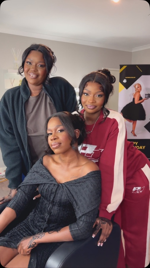 Three women after a group makeup session